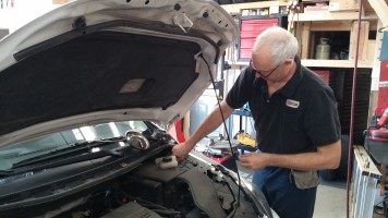 Dyrell, our senior diagnostician, inspects a master cylinder reservoir