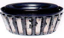 Picture of a differential carrier bearing with heavy deposits on it